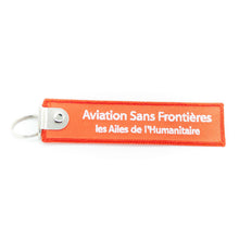 Charger l&#39;image dans la galerie, Porte-clés flamme Aviation Sans Frontières &quot;REMOVE BEFORE FLIGHT&quot;